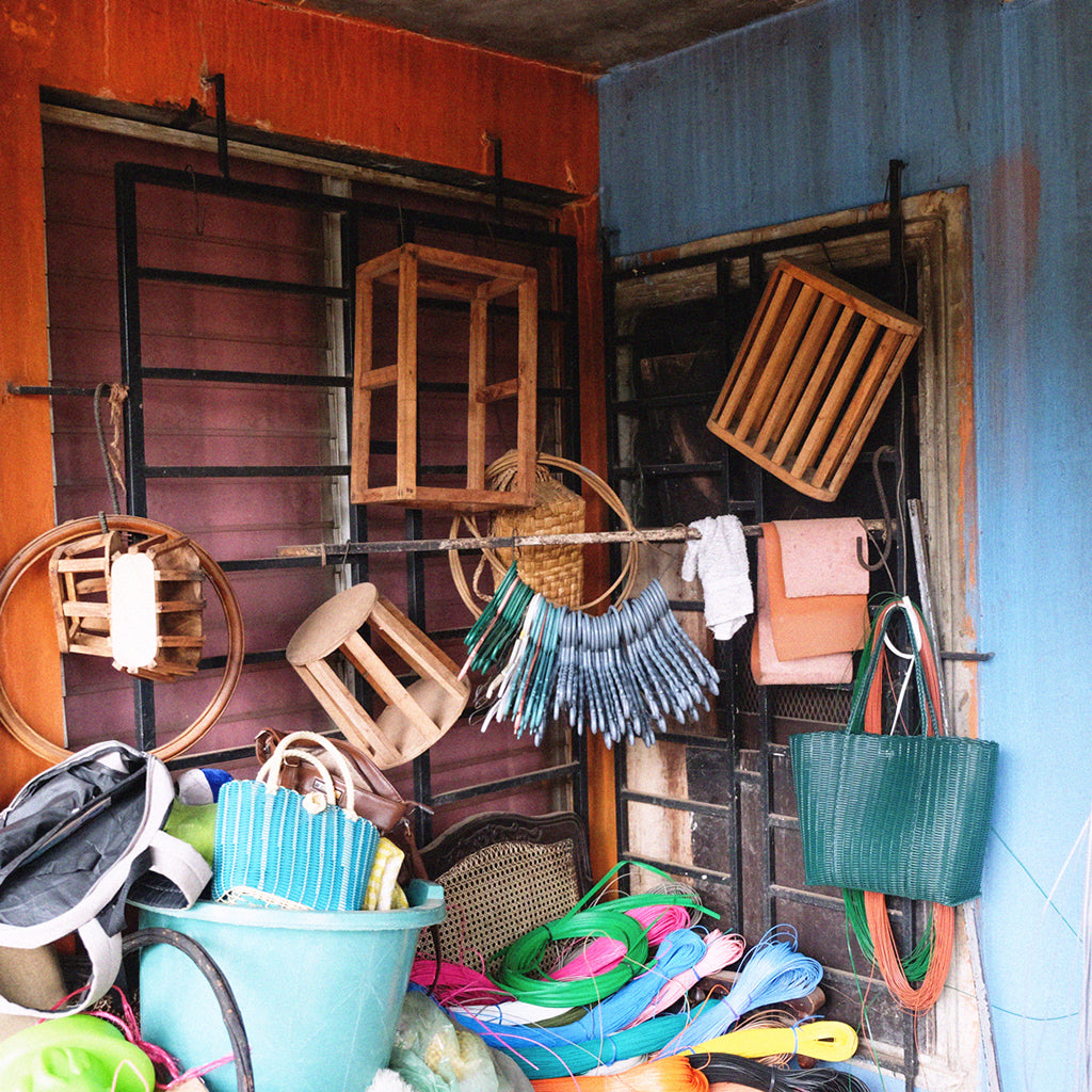 Weaving materials and wooden moulds displayed in a workshop in El Salvador