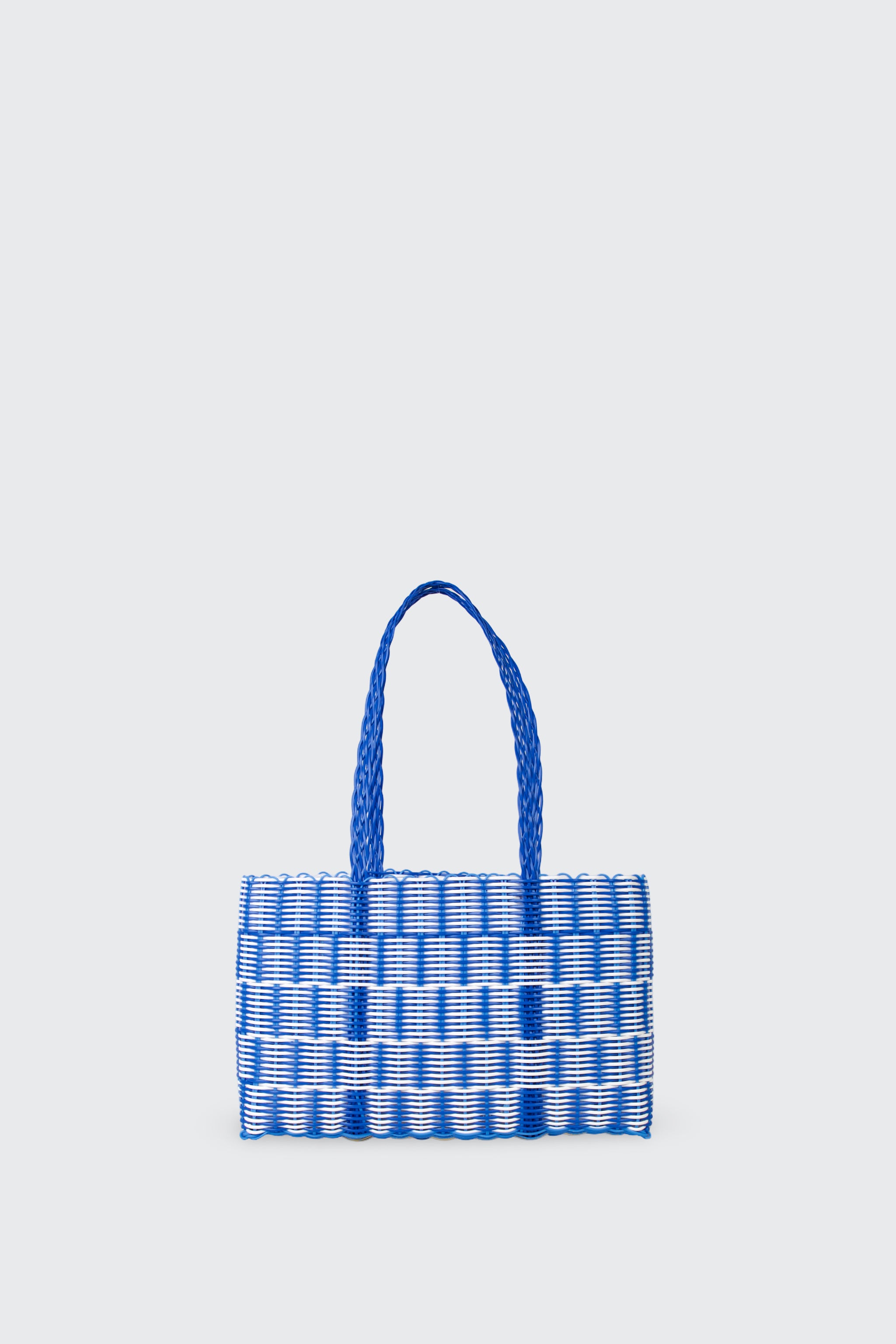 Blue woven basket bag on a light gray background