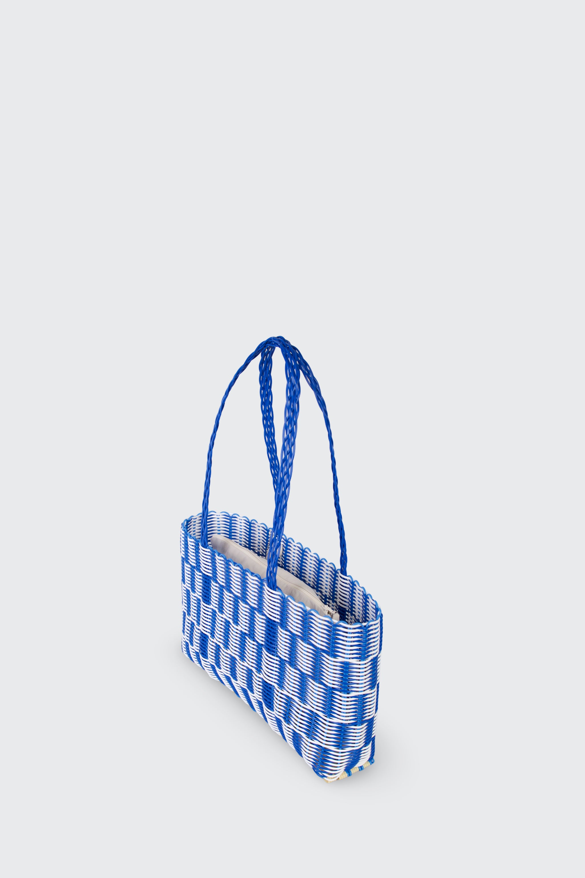 Blue and white checkered bag on a light gray background